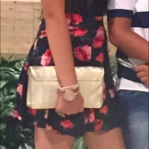 Black skater skirt with red roses on it